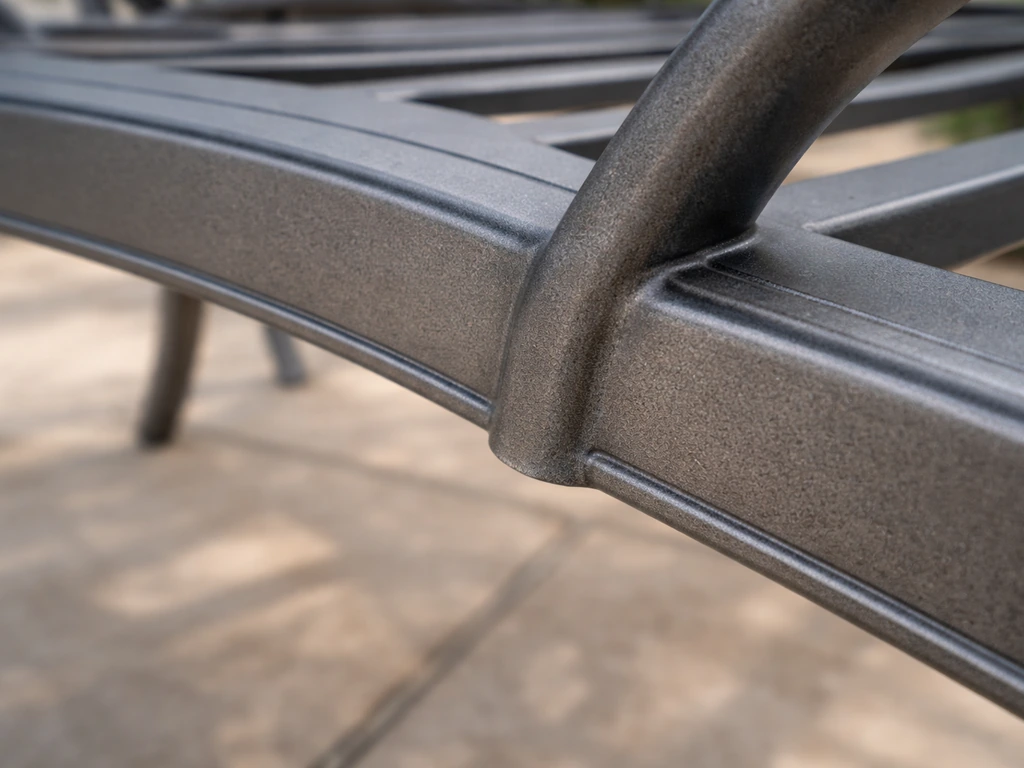 Close-up of underside of a cast-aluminum frame with smooth, consistent casting and no rough pitting.